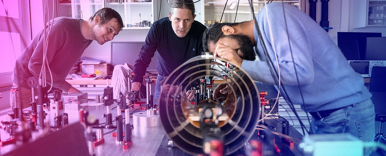 Researchers working on an experimental setup