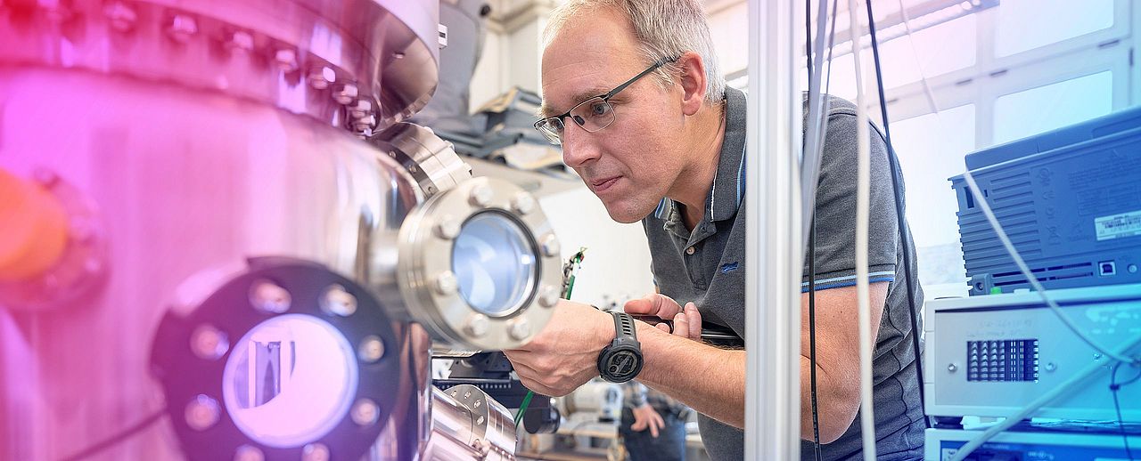 Researcher working on an experimental setup